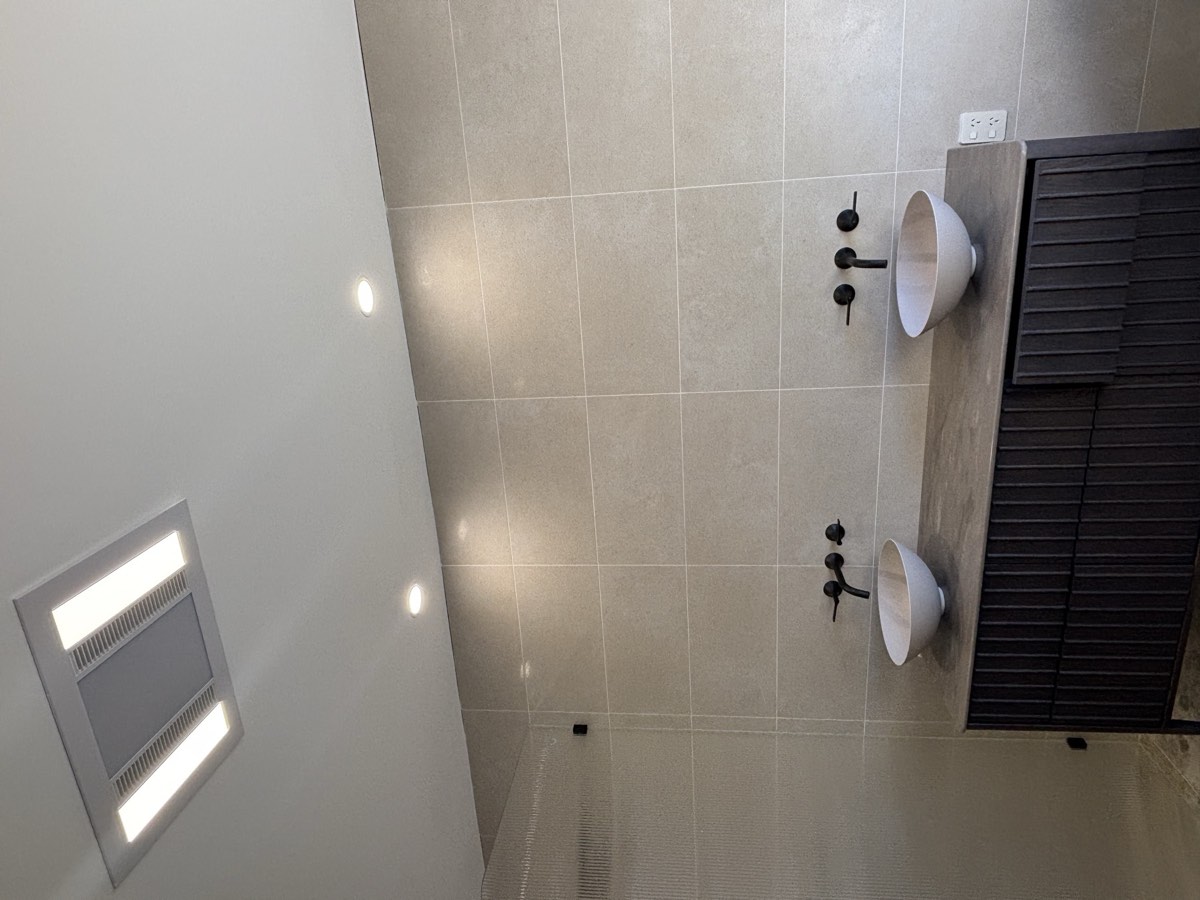Three-in-one exhaust fan, light and heater unit installed in a Gold Coast bathroom